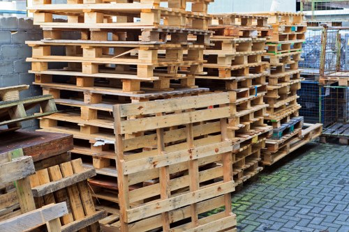 Workers managing builders waste on a construction site